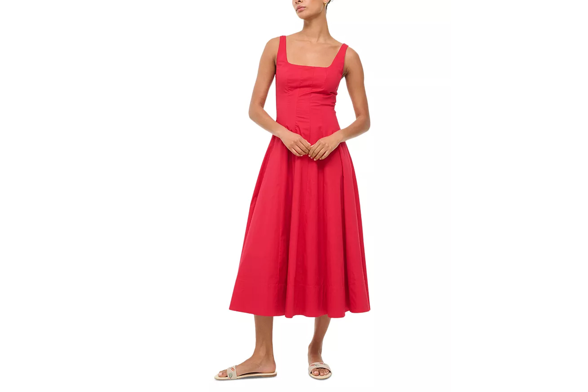 A model wearing a red Staud Wells dress with a square neckline, and beige sandals.