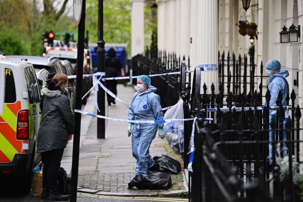 Forensics at the scene where a woman was found with stab wounds in her home in Stanhope Place, Bayswater.