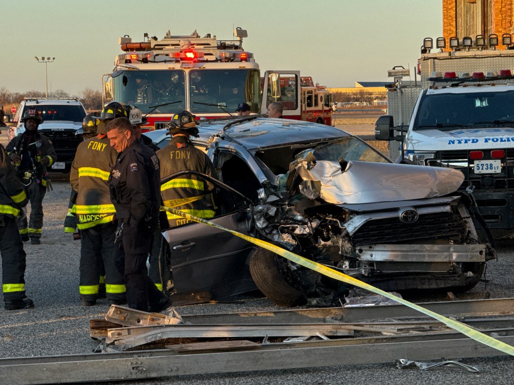 Police and firefighters at the scene of an SUV into a historic airport hanger at Floyd Bennett Field in Brooklyn. Wednesday, April 8, 2026.