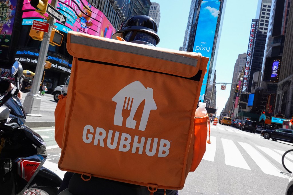 A Grubhub delivery person riding in Manhattan, New York City.