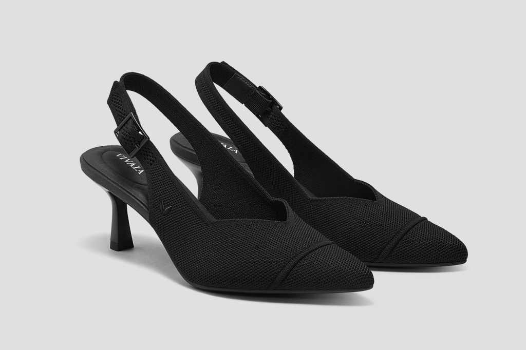 Pair of black slingback heels with pointed toes and thin heels.