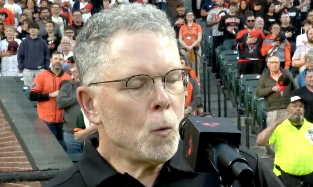 Whistler Chris Ullman is seen performing the national anthem prior to the Orioles-Giants game.