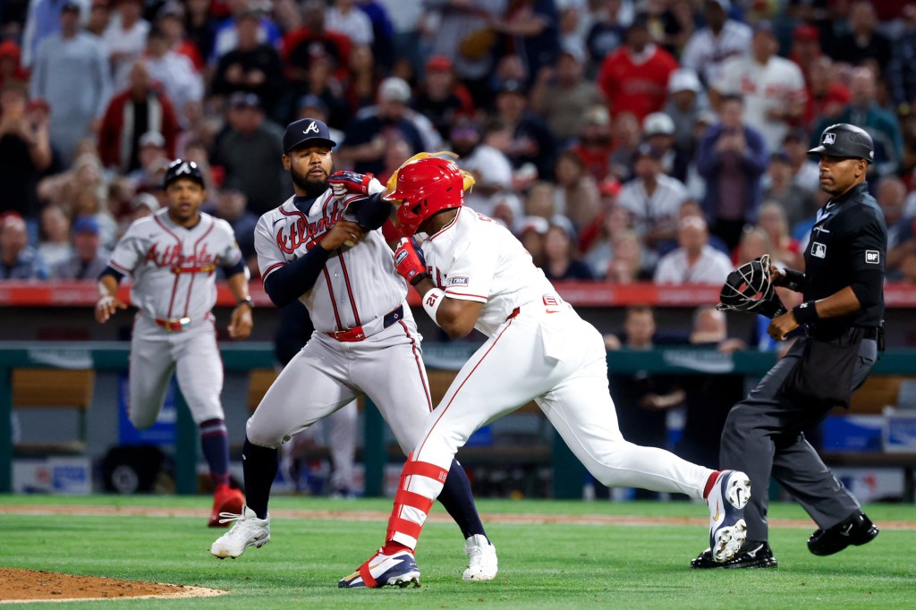 A fight breaks out between Atlanta Braves pitcher Reynaldo López (40) and Los Angeles Angels right fielder Jorge Soler (12) during the fifth inning at Angel Stadium. 