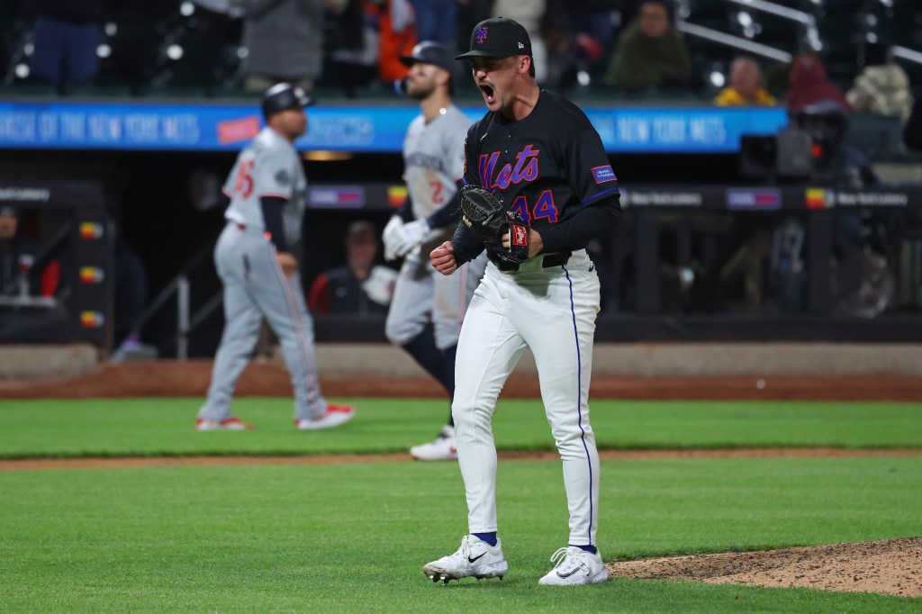 New York Mets pitcher Austin Warren (44) celebrates getting out of the ninth inning.