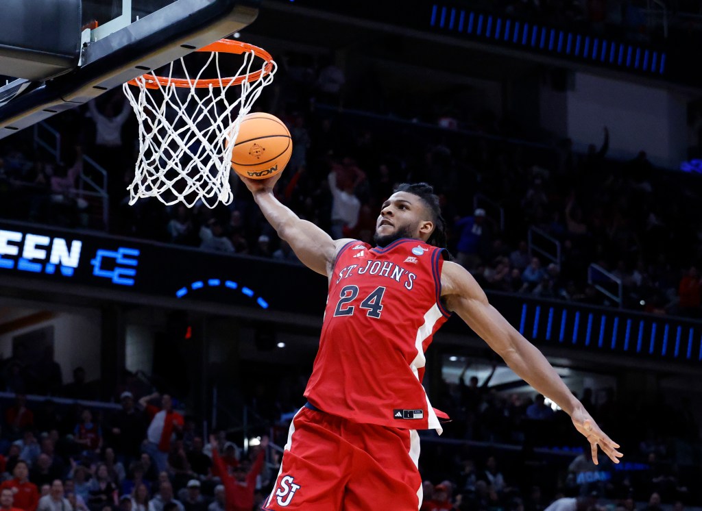 St. John's Red Storm forward Zuby Ejiofor dunks the ball.