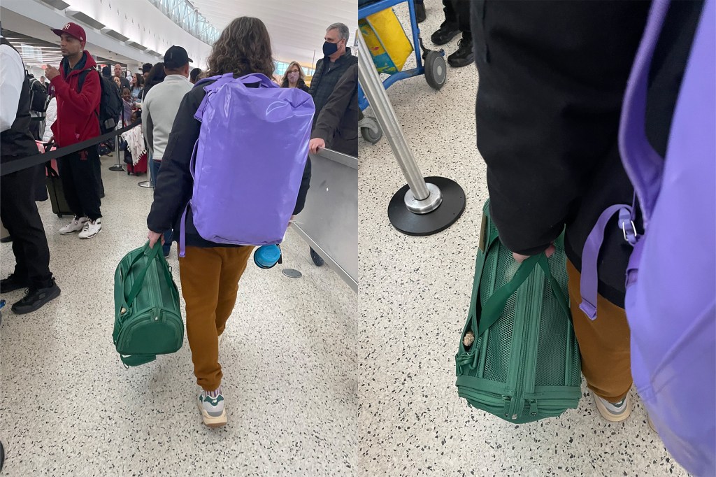 Dog carrier being held at an airport for travel. 