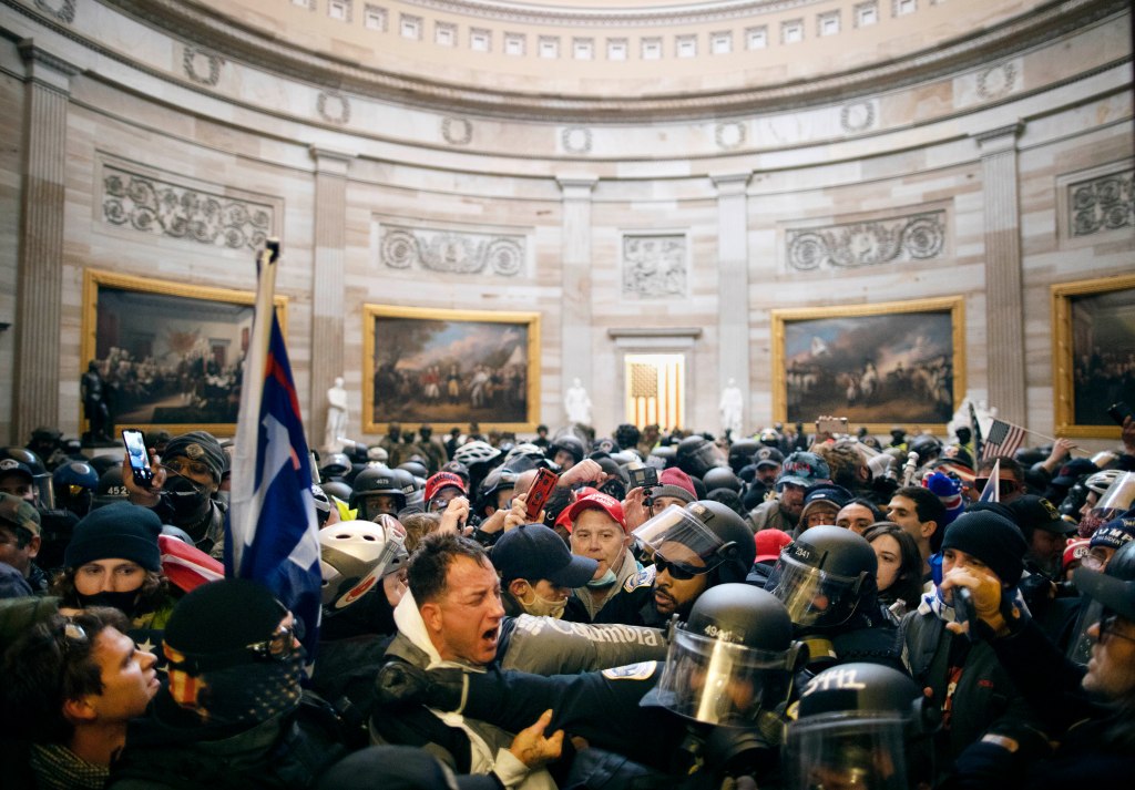 Police clash with Trump supporters inside the US Capitol building.