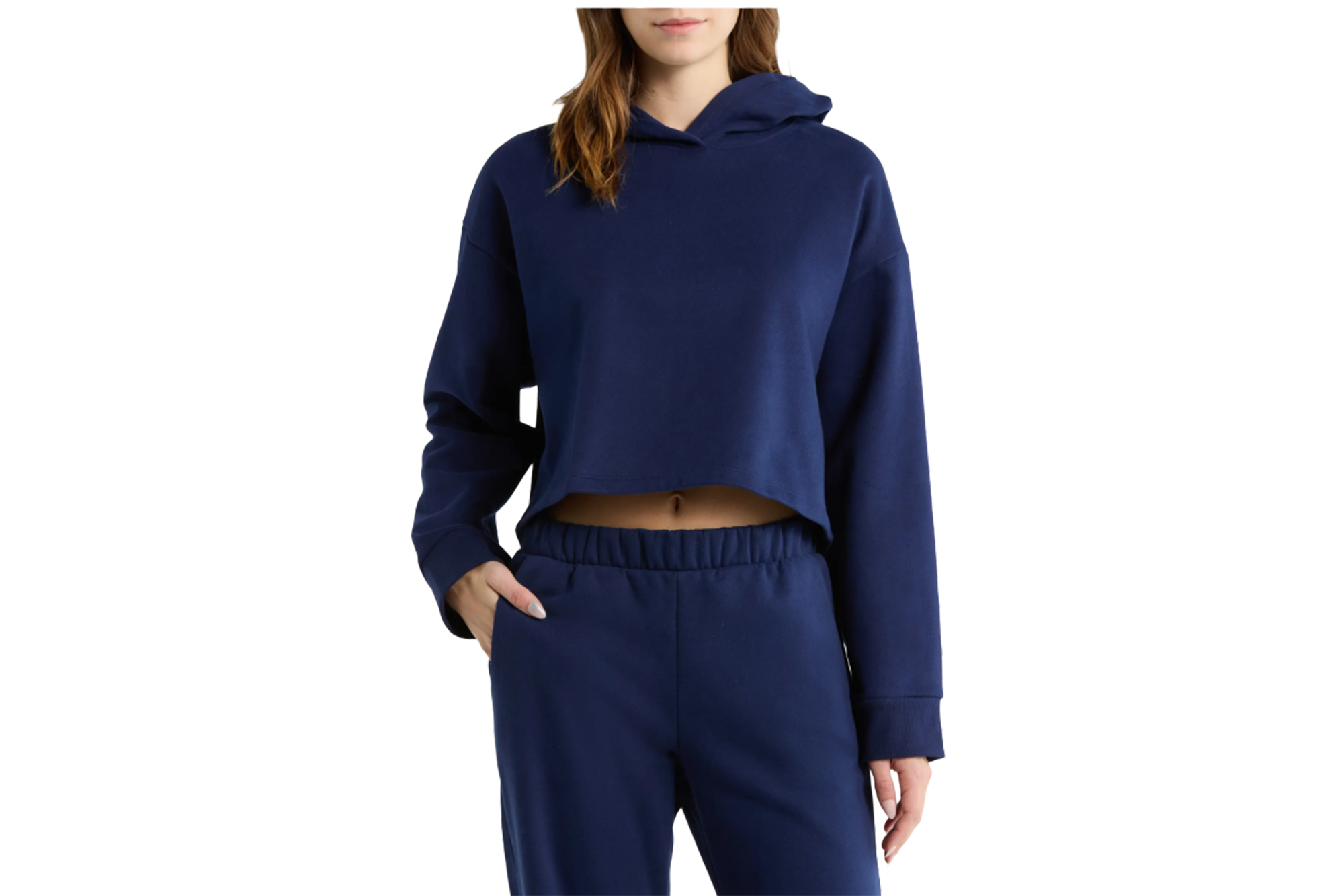 Woman wearing a navy blue cropped hoodie and matching sweatpants.