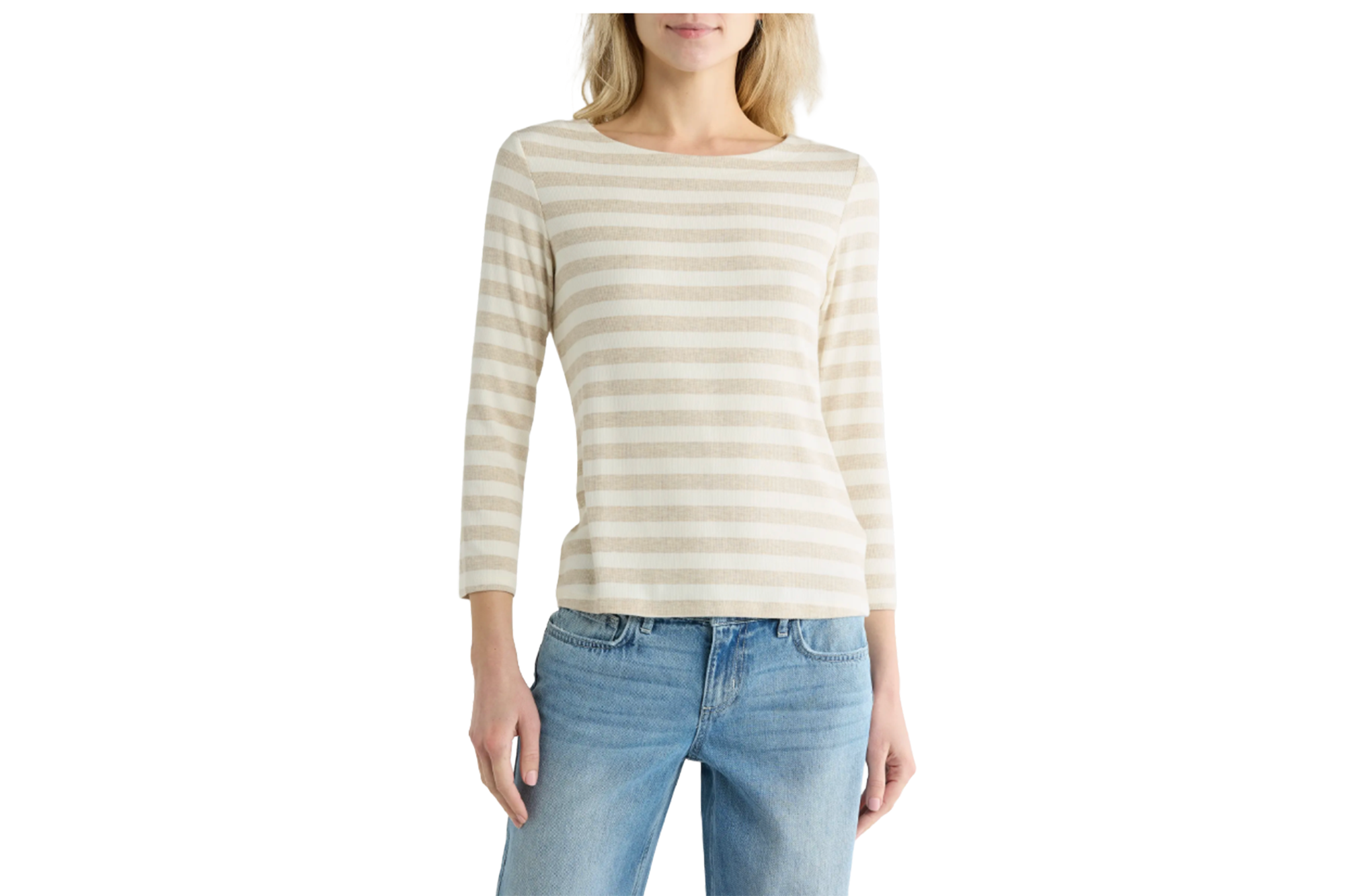 A woman wearing a striped long-sleeved shirt and blue jeans.