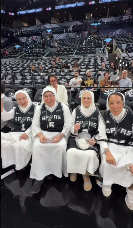 The Salesian Sisters yelling "Go Spurs Go" before Game 4 on Sunday.