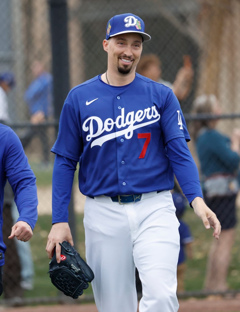 Baseball player Jason Heyward walks on the field wearing a Los Angeles Dodgers uniform with the number 7.